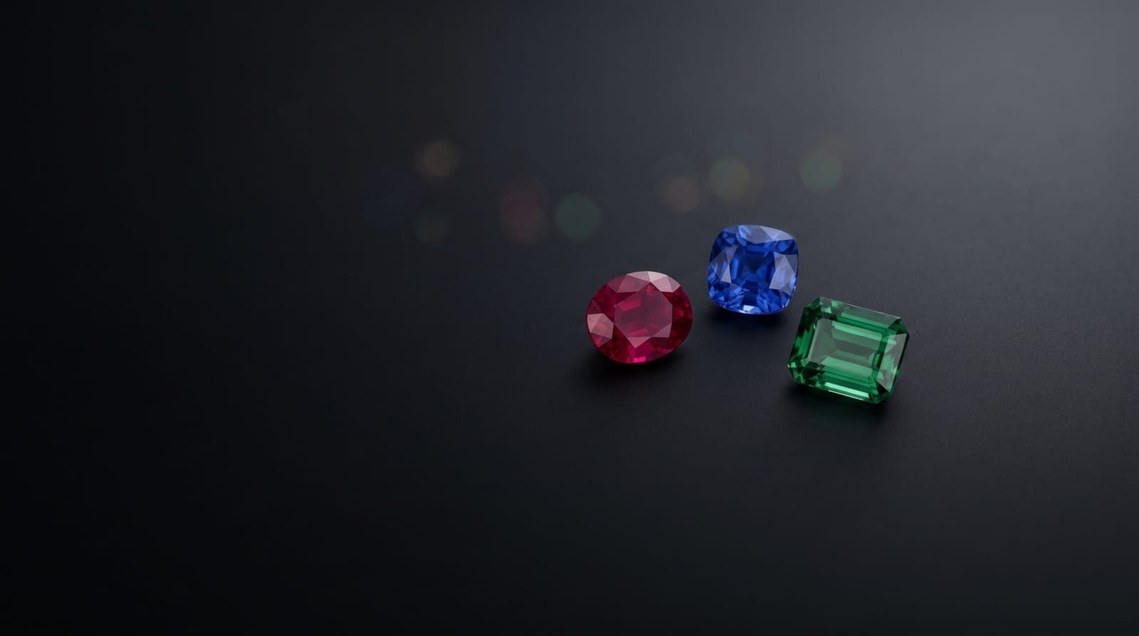 Gemstone parcels with price tags on a dealer's sorting pad
